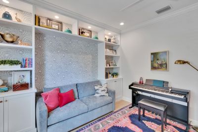 Family room with built-ins and keyboard. 